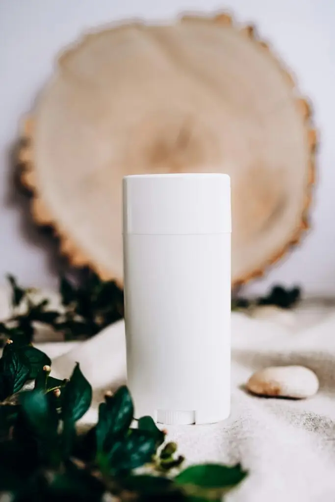 Discovering Your Home's Signature Scent with a Scent Diffuser White scent diffuser surrounded by fresh leaves, enhancing natural ambiance.